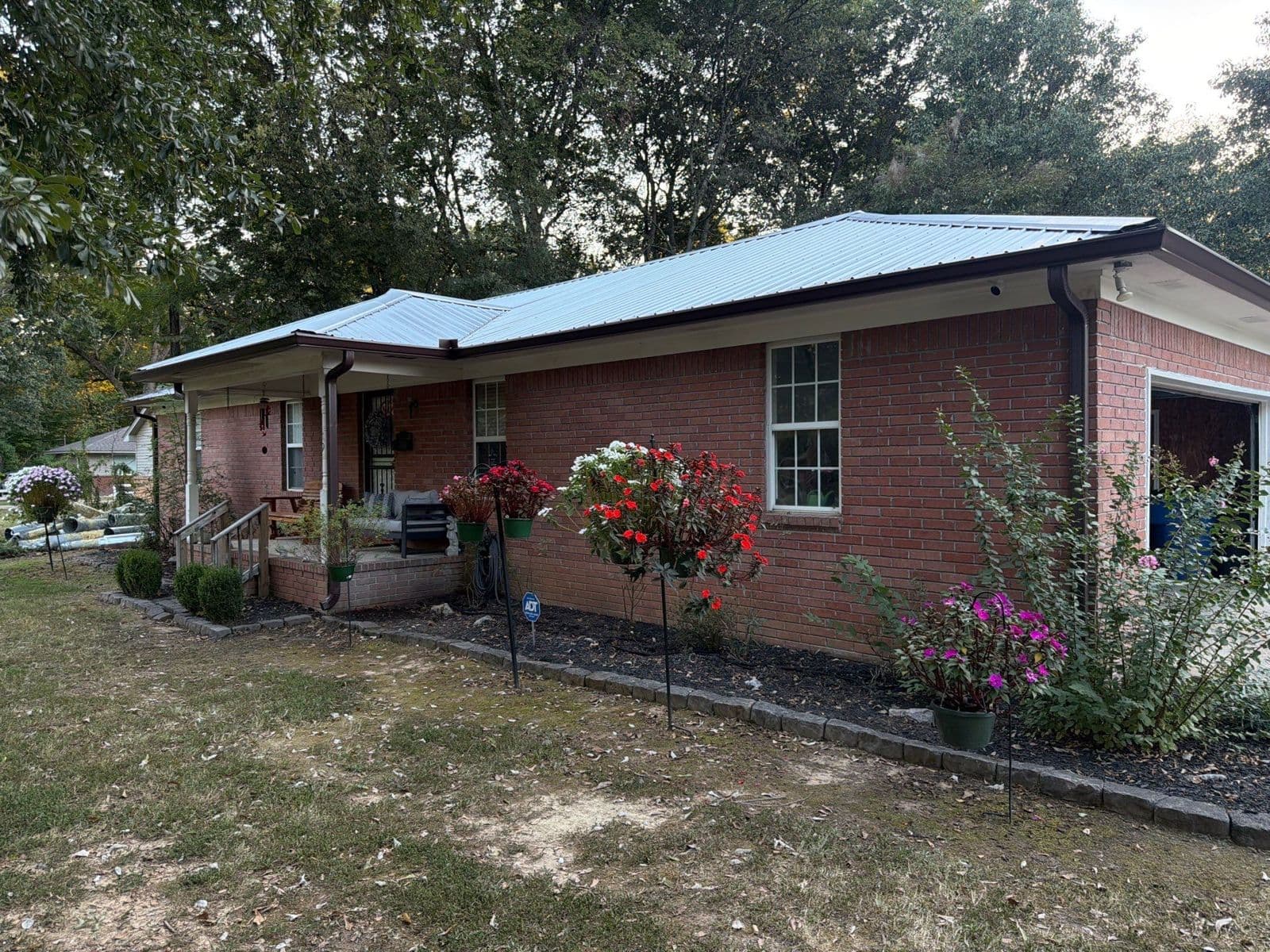 Brick ranch home in the Memphis area with new 6-inch Royal Brown gutters and downspouts