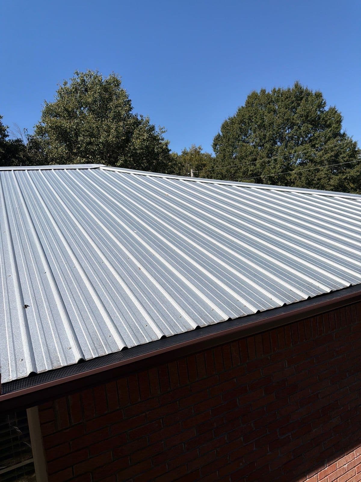 View from the roof of a guarded gutter running the length of the eave