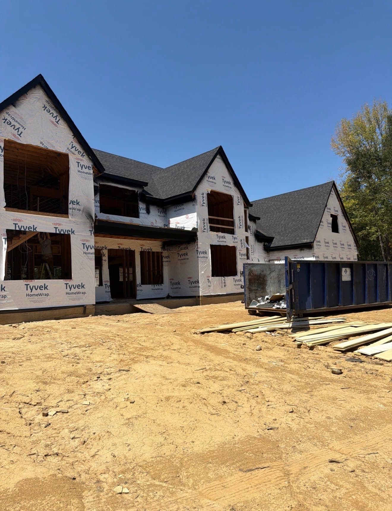 Finished architectural shingle roof by Precision Roofing on a two-story home