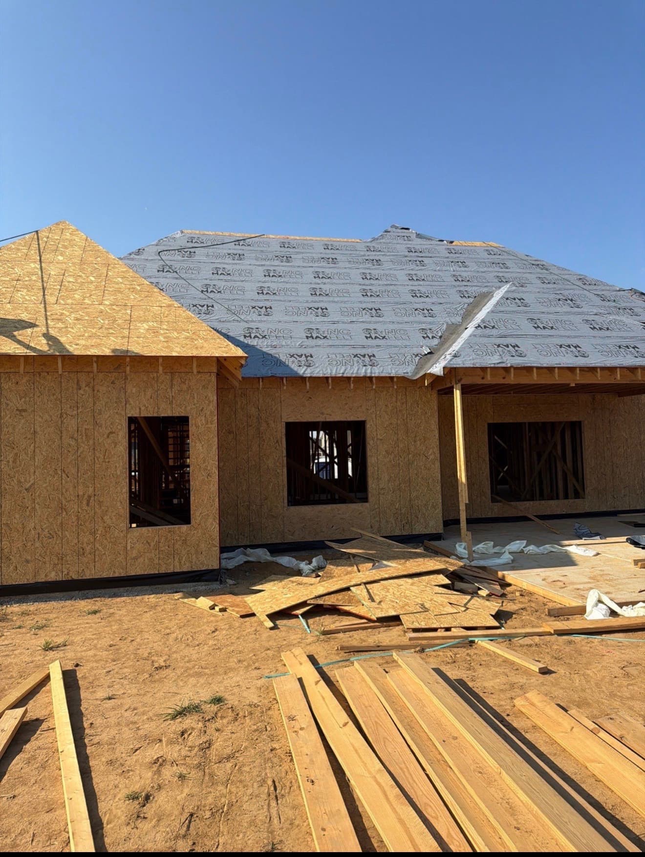 Hip roof dried in with synthetic underlayment on a Mid-South home