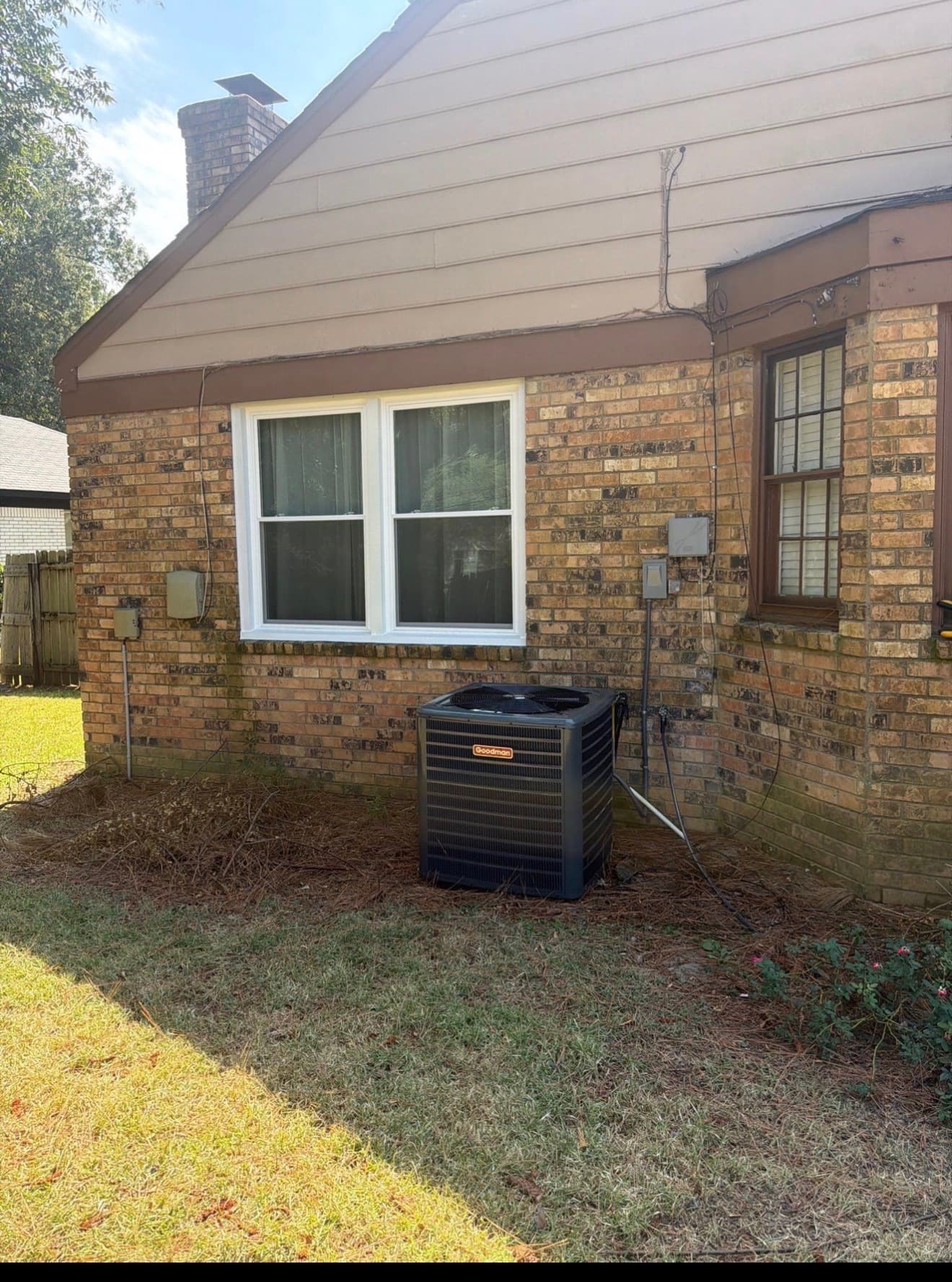 New white vinyl replacement windows installed in a Memphis-area brick home
